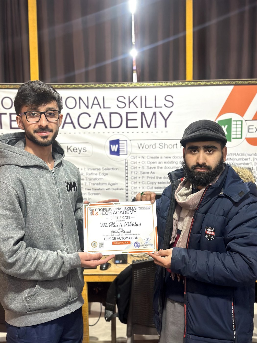 Graduate receiving Office Automation certificate at PSTA Abbottabad